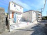 【前面道路を含む現地外観(1号棟)】